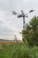 Fully automatic metal wind watermill seen from the back