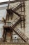 Fully rusty iron staircase in an abandoned old Soviet industrial