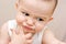 Fun caucasian baby with finger