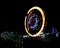 Fun fair Giant Colorful Ferris wheel spinning at night. Slow shutter image of a rotating giant wheel at night