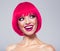 Fun fashion model with bright make-up.  Laughing Model with creative colored bob hairstyle