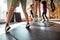 Fun fitness defined. Cropped shot of female trainer exercising with teens, boys and girls in gym. Warming up on a sunny