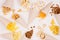 Fun fresh summer fast food background - snacks - nacho, croutons, chips, tortilla, popcorn in cone on white wood background.