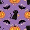 Fun hand drawn Halloween design with cats, bats, pumpkins and candy treats. Seamless vector pattern on purple background