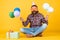 Fun and happiness concept. happy man holding colorful helium balloons. hipster smiling happily. having fun on party