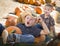 Fun Little Boys Playing in Wheelbarrow at the Pumpkin Patch