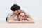 Fun loving young couple lying on the floor