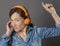 Fun middle aged woman listening to music for joyous wellbeing