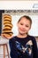 fun portrait of a smiling girl with her stack of donuts in balance