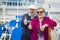 Fun Senior Couple Give a Thumbs Up on Deck of Cruise Ship