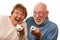 Fun Senior Couple Play Video Game with Remotes