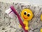 Fun yellow emoji smiling toothbrush holders for kids