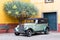 FUNCHAL, PORTUGAL - JULY 22, 2018: Wing, wheel and headlight of a 1932 vintage car parked in Fortaleza de Sao Tiago in