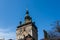 Functional medieval clock on the tower with moving hand carved wood dolls.