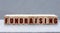 FUNDRAISING - word on wooden bars on a gray background