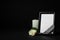 Funeral photo frame with ribbon, white rose and candle on dark table against background. Space for design