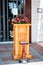 Funerary urn with ashes of dead and flowers at funeral