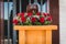 Funerary urn with ashes of dead and flowers at funeral