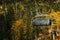 Funicular high in the mountains above the autumn forest