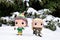 Funko Pop action figures of Buddy from comedy movie Elf and elf Legolas from fantasy movie The Lord of the Rings.