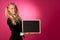 Funky business woman holding a blank blackboard - teacher
