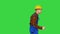 Funky dancing by young construction worker in safety hat on a Green Screen, Chroma Key.