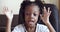 Funny African girl in headphones speaks in webcam, child answers video call, speaks in microphone on radio connection