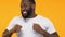 Funny Afro-American man dancing and fooling around, celebrating victory, closeup