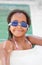 Funny afroamerican girl with goggles in the pool