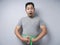 Funny Asian Man SHocked Worried to See His Big Belly, Overweight Problem Concept