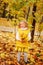 Funny autumn portrait of happy toddler girl walking outdoor