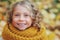 Funny autumn portrait of happy toddler girl walking outdoor