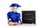 Funny baby in academician clothes at chalkboard