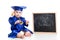 Funny baby with bell in academician clothes at