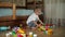 Funny baby boy with educational toy blocks.