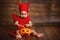 Funny baby in devil halloween costume with pumpkin