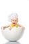 Funny baby emotions. Little Chef. Adorable baby boy dressed in s chef`s hat sitting in egg shell. isolated on white