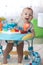 Funny baby playing in baby walker