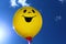 Funny balloon in front of the sky