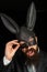 Funny bearded man in carnival rabbit mask. Bearded hipster in suit is ready for carnaval. Handsome man with beard in