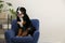 Funny Bernese mountain dog on armchair