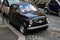 Funny black small old little italian car with round headlights a