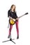 funny blonde girl guitarist plays solo by electric guitar, smiles, sings into retro microphone. Woman teacher shows