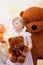 Funny blonde girl posing with teddy bears