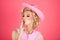 Funny blonde woman with pink cowboy hat. Young american cowgirl woman portrait.