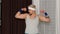 Funny bodybuilder sportsman guy couch showing biceps, sport fitness boxing exercises with dumbbells