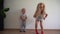 Funny bored kids have fun. blond girl running in one place. Gimbal motion