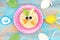 Funny breakfast for kids. oatmeal with fruits. blue wooden background, top view. Easter breakfast idea for children