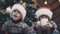 Funny brother and sister drinking hot chocolate and making fun in a cozy living room on Christmas eve.