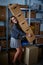 Funny businesswoman holding storage boxes